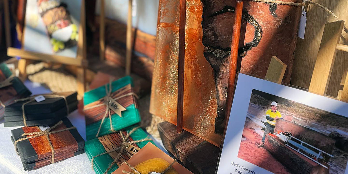 Photo of David with his first find of wood in the quarry and some beautiful examples of the timber resin products he hand crafts